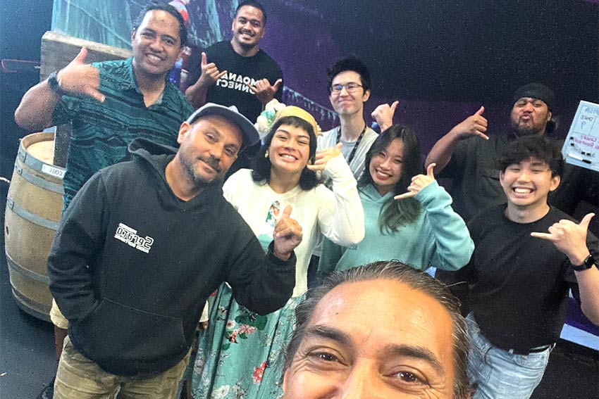 A group of people taking a selfie of them standing together